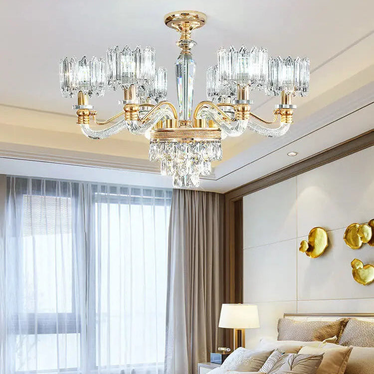 Luxurious bedroom with a large chandelier, bed, and decorative elements.