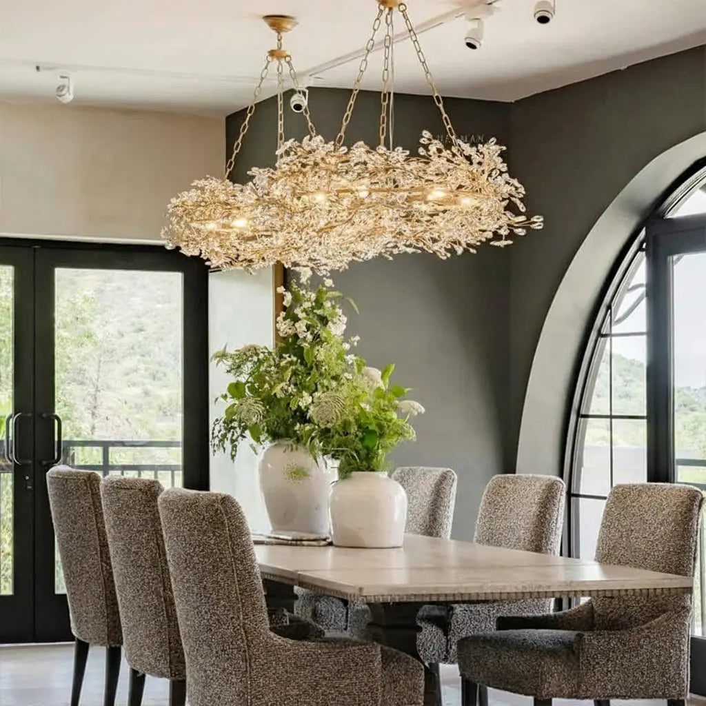 Dining room with a luxurious chandelier, table, and chairs, featuring YIOSI Lighting branding.