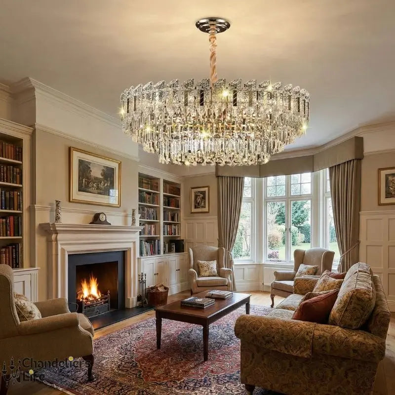 Luxurious living room with a chandelier, fireplace, and comfortable furniture.