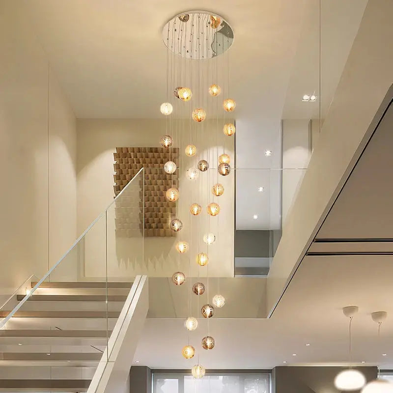 Modern chandelier hanging from a ceiling in a stylish interior setting.