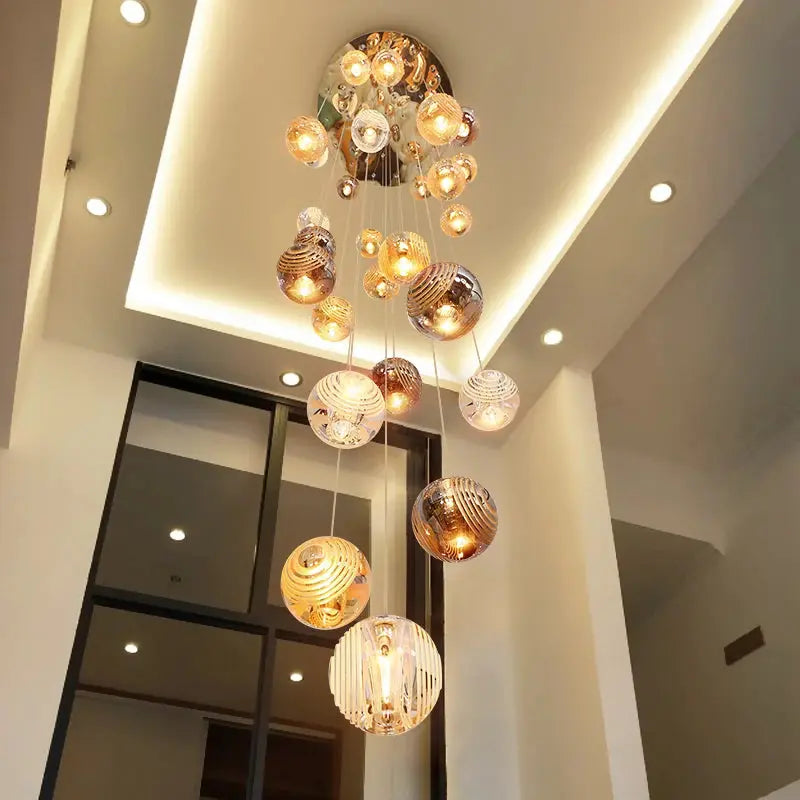 Modern chandelier hanging from a ceiling in a well-lit room