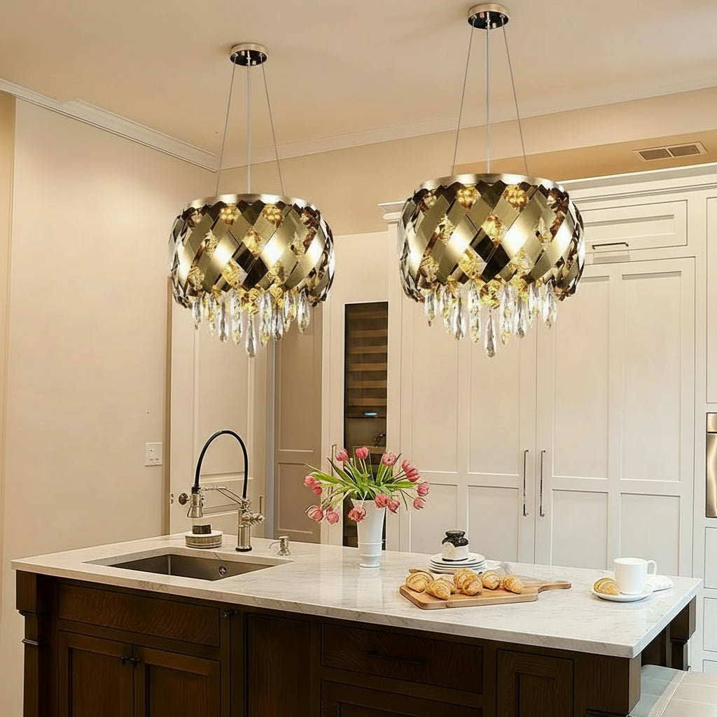 Modern stainless steel crystal chandelier in a kitchen setting with 'Artpad' branding.