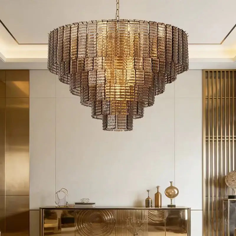 Ceiling chandelier featuring a graduated arrangement of glass panels