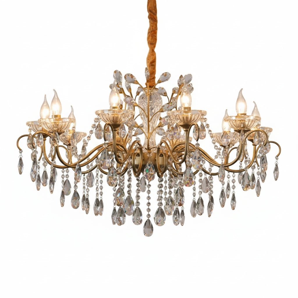 Gold chandelier with crystal accents in a room setting.