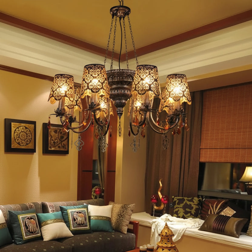 Decorative chandelier hanging in a living room with a couch and wall art.