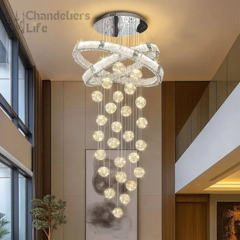 Modern chandelier hanging from a ceiling in an indoor setting with 'Chandeliers Life' branding.
