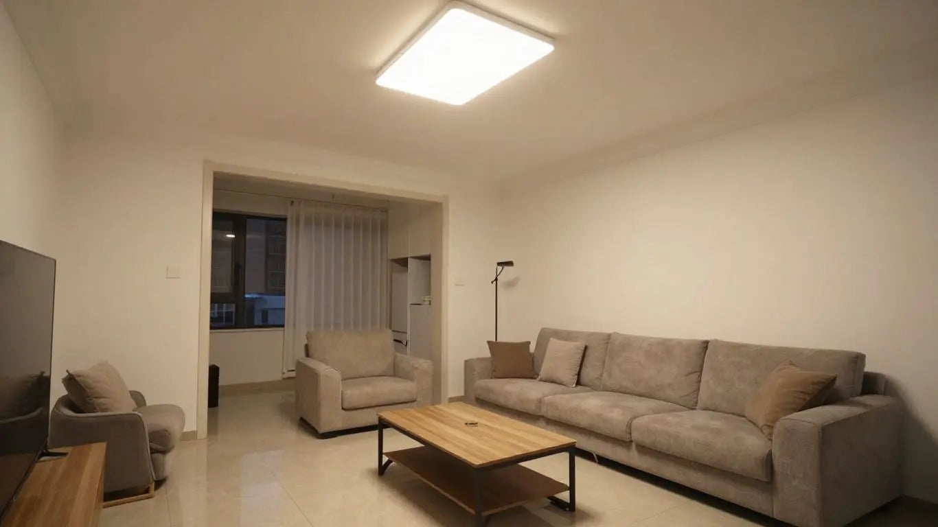 Modern living room with flush-mount lights on low ceiling.