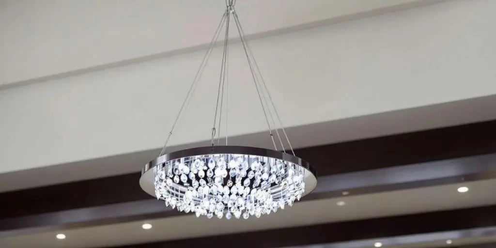 Modern chandelier in a high-ceilinged room.