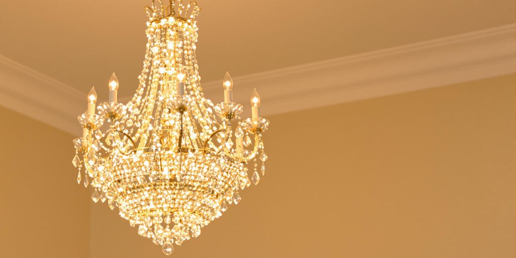 Elegant chandelier with sparkling crystals in a bright room.