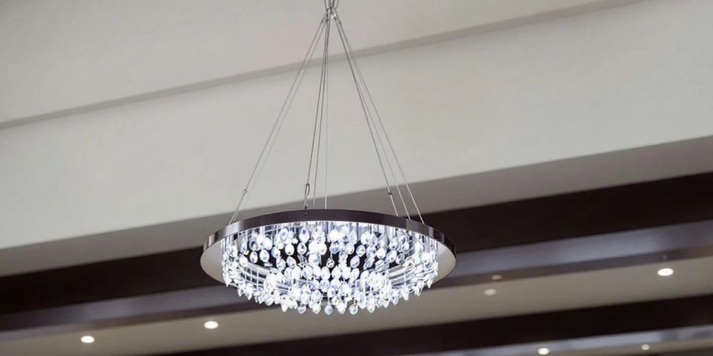 Modern chandelier in a high-ceilinged room.