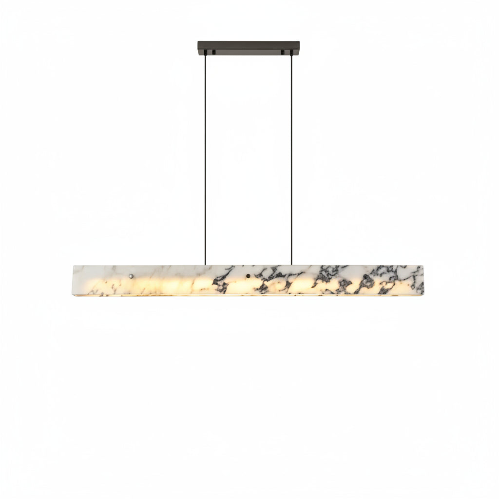 Modern pendant light fixture hanging in a room with white walls and ceiling.