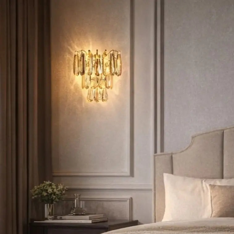 Decorative wall sconce in a bedroom setting with soft lighting.