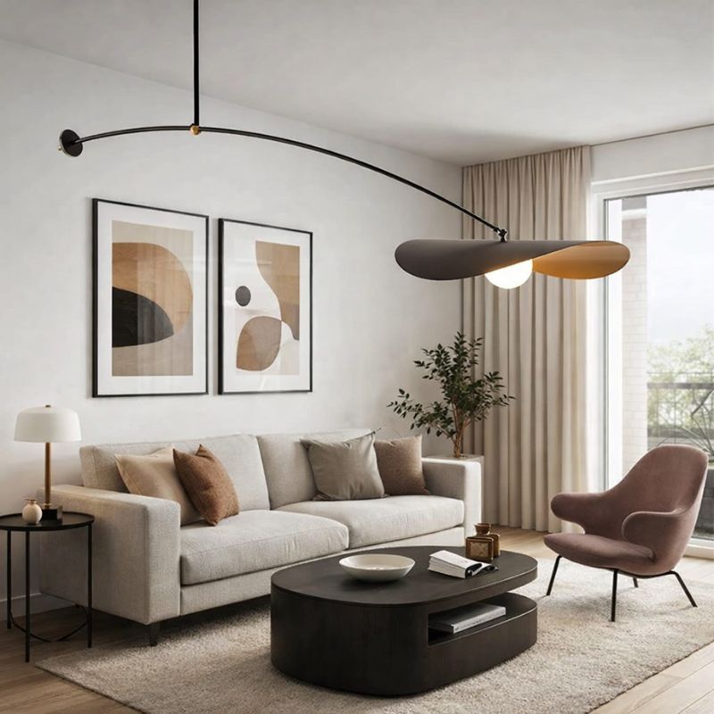 Modern living room with a beige sofa, round coffee table, and abstract art on the wall.