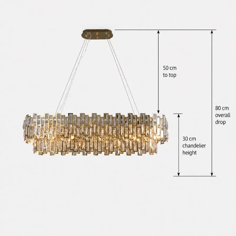 A modern cylindrical chandelier with layered rectangular glass shades suspended from a brushed brass ceiling canopy, shown with dimension callouts indicating 50 cm to top, 80 cm overall drop, and 30 cm chandelier height.