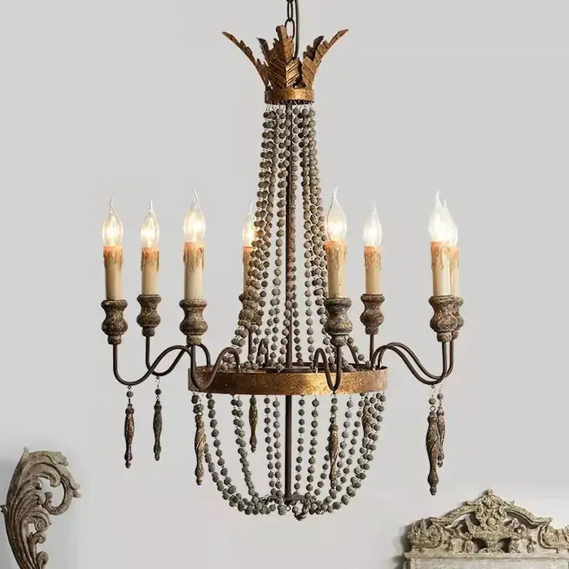 Decorative chandelier with candles on a light gray background