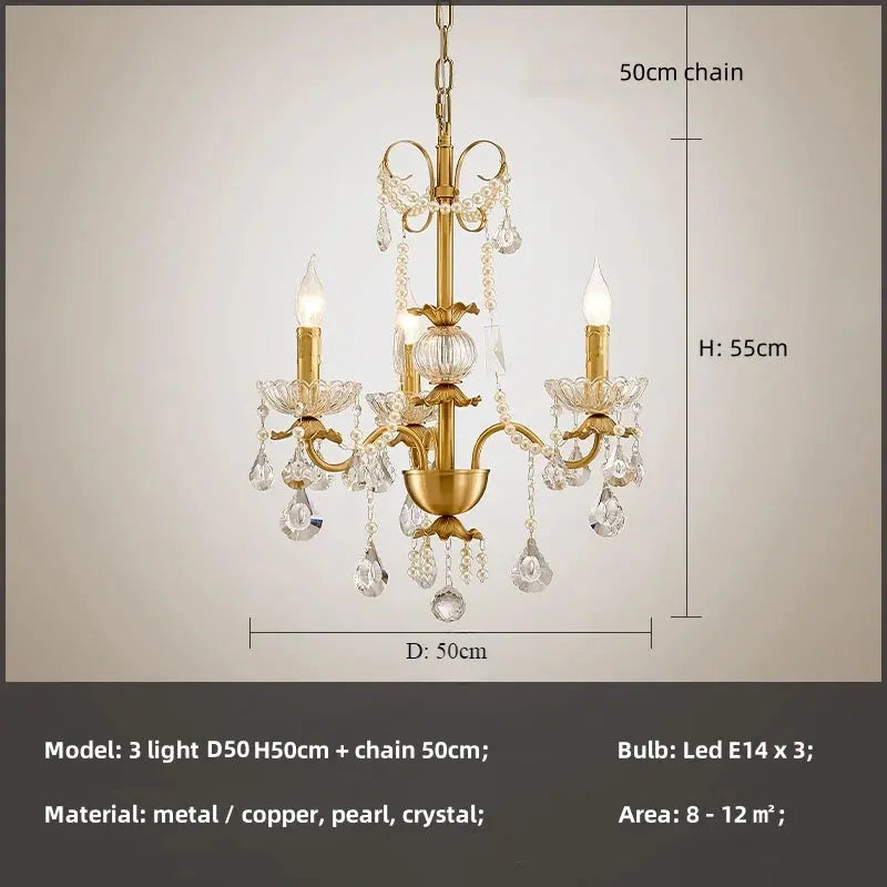 Gold chandelier with crystal accents and dimensions on a neutral background