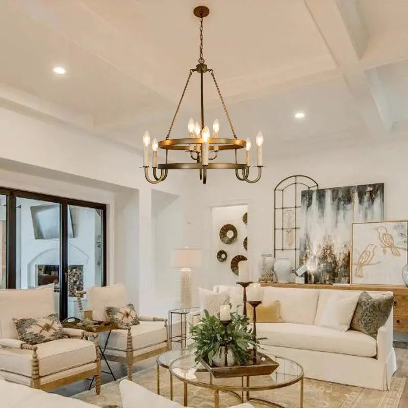 Living room with a chandelier, sofa, and decorative items.
