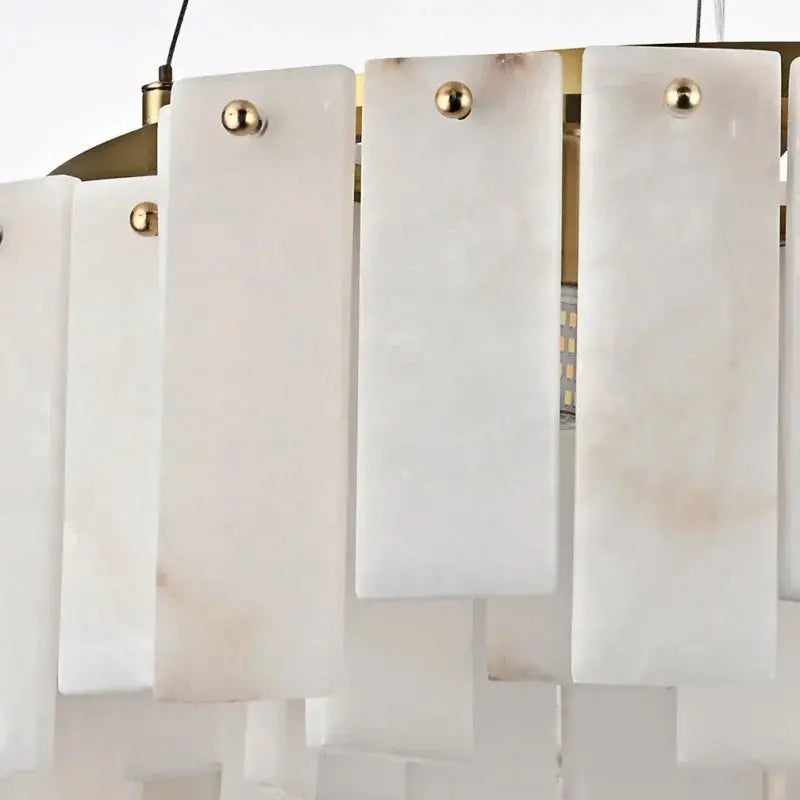 Chandelier with white marble panels and gold accents