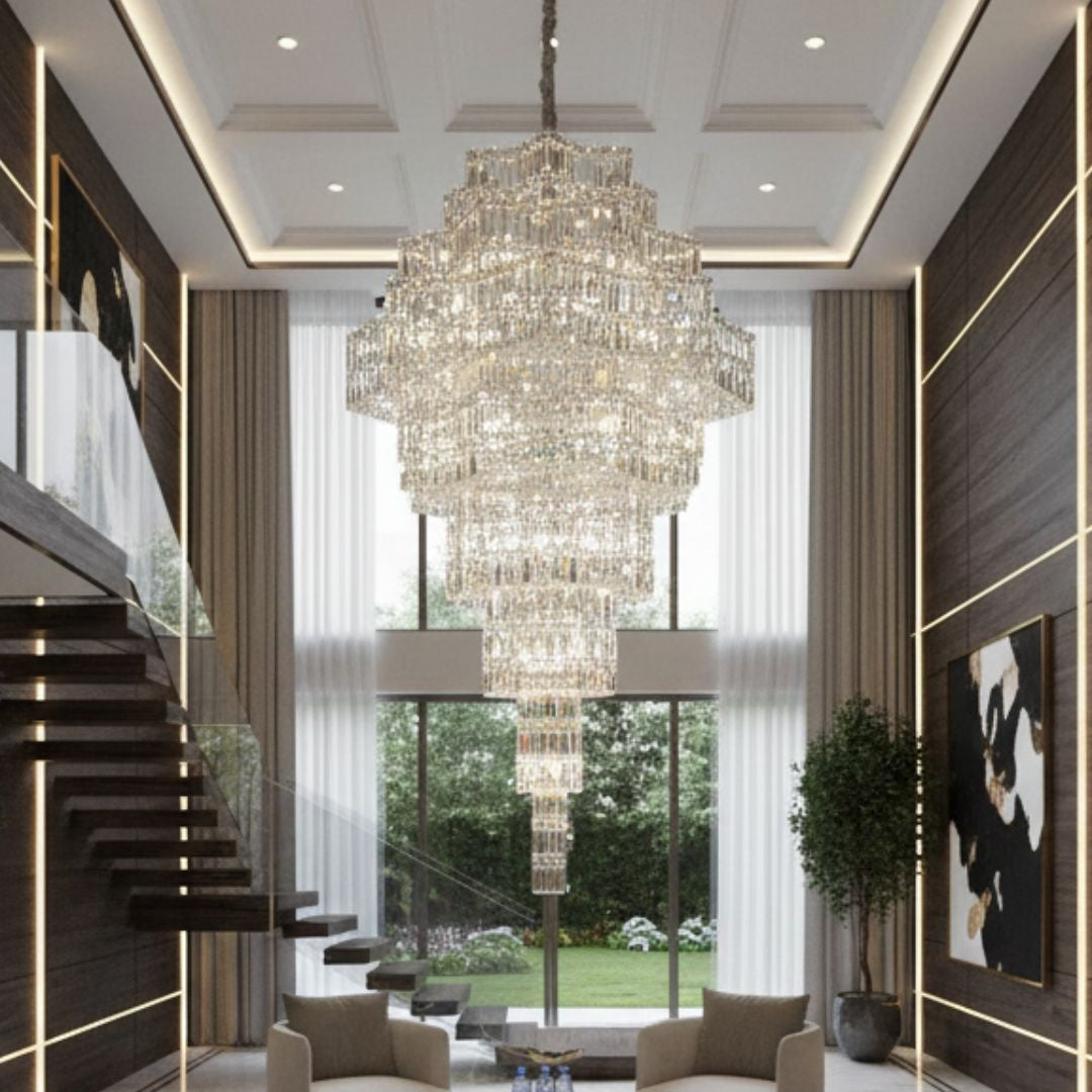 Luxurious interior with a chandelier, modern furniture, and large windows.